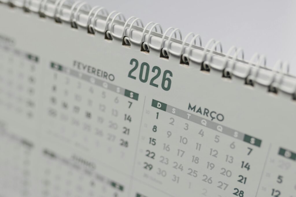 Close-up view of a 2026 spiral-bound desk calendar showing February and March.